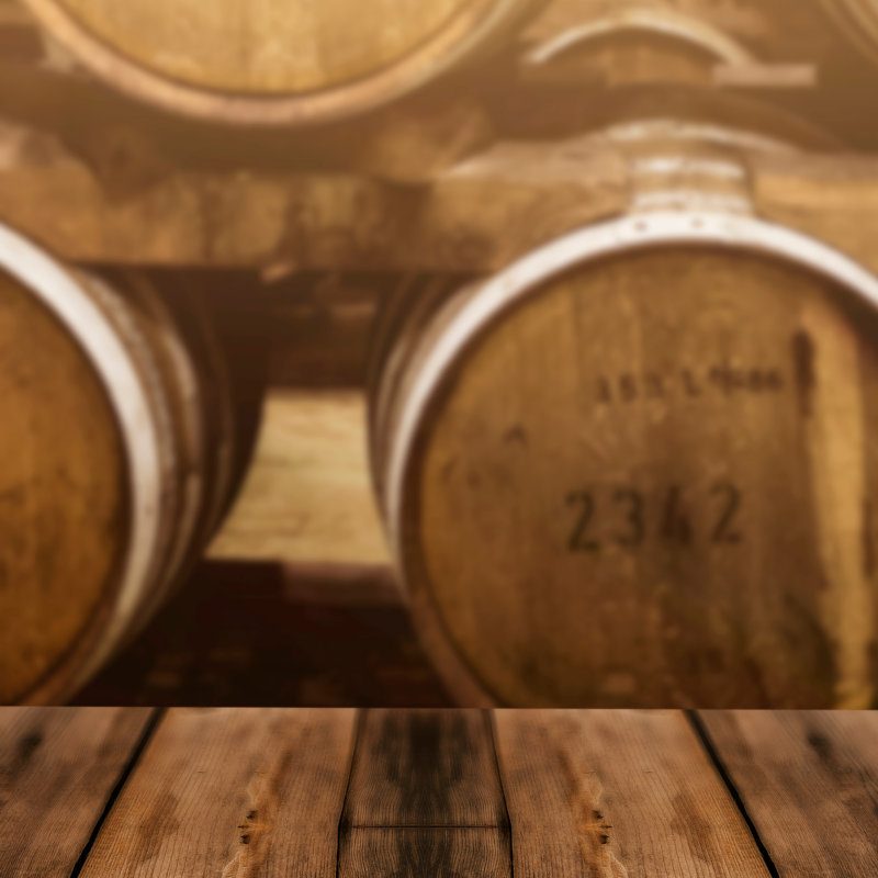 Whisky maturing in barrels at a distillery