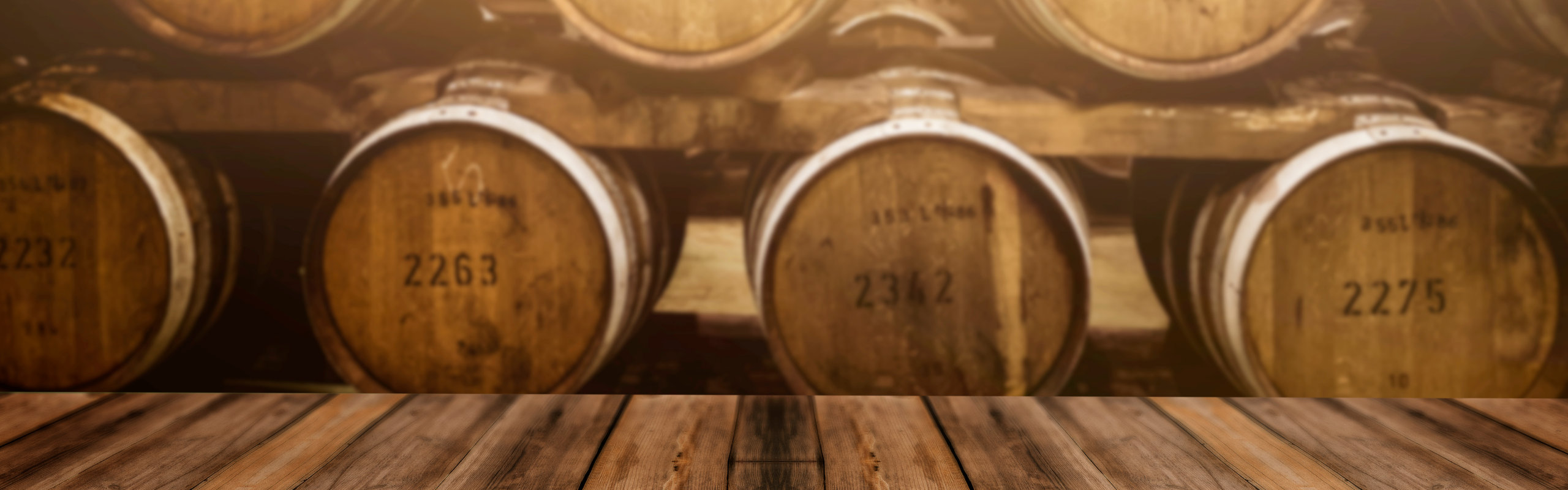 Whisky maturing in barrels at a distillery