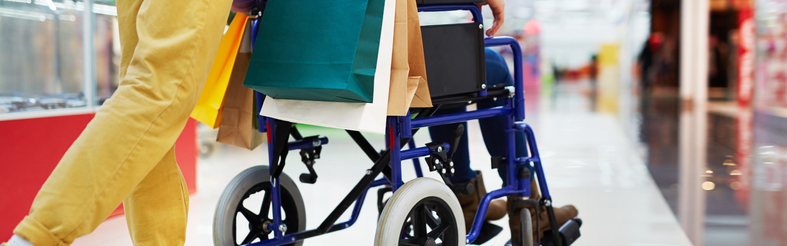 Person shopping with friend in wheelchair
